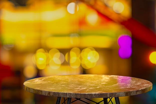 Empty marble table in night bar