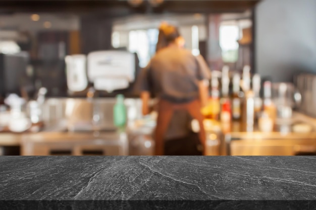 Empty marble table top with coffee shop cafe restaurant counter blur background