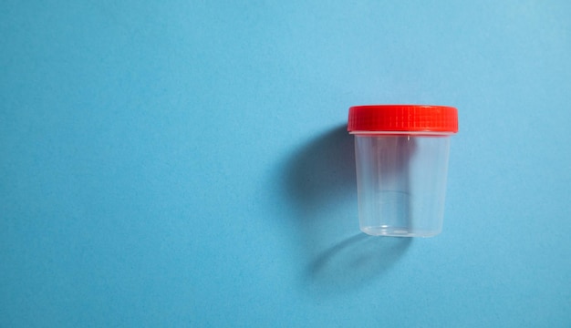 Empty medical container on the blue background