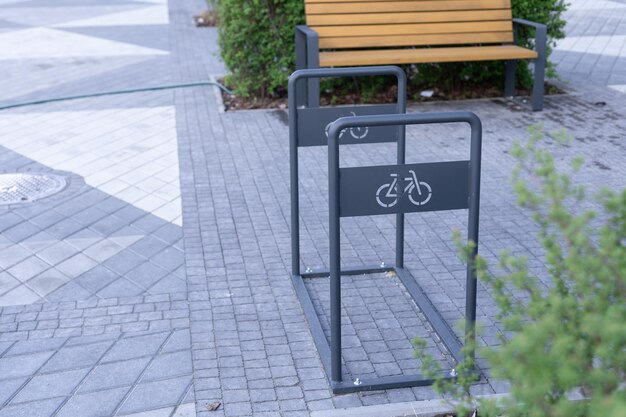 empty metal construction for parking at the house or shop of bicycles or scooters, environmental transport in the city. perspective, looking into the distance.