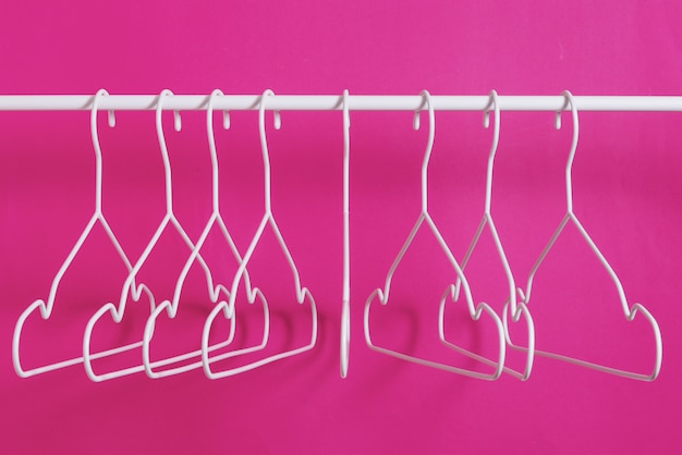 Empty metal hangers on the bar