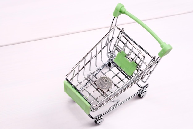 Empty mini shopping cart on the table top view