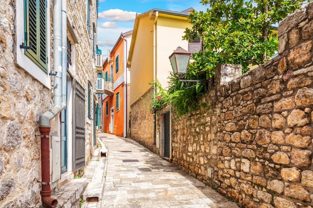 Empty narrow medieval European street in the Old Town of Herceg Novi, Montenegro.