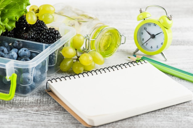 Empty notebook and berries