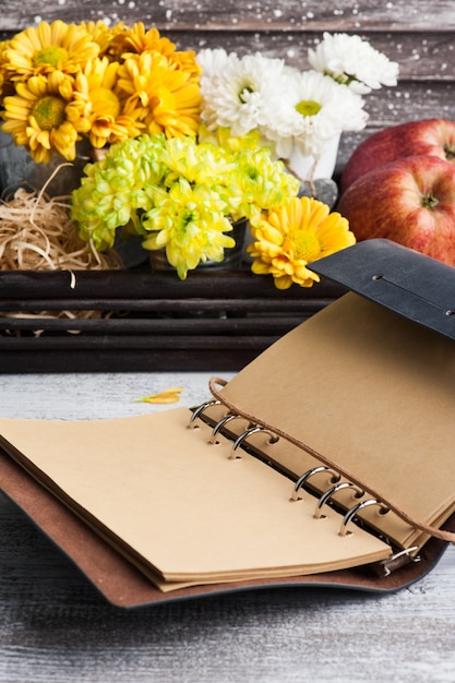 Empty notebook and chrysanthemum