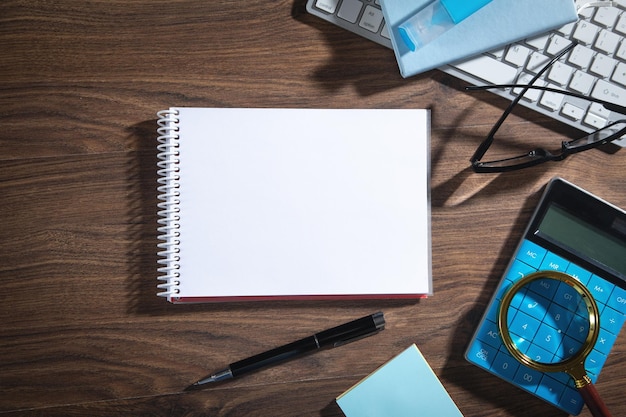 Photo empty notepad computer keyboard and other business objects