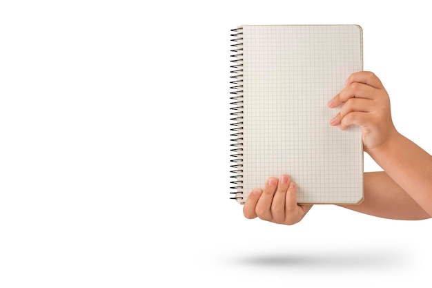 Empty notepad in hand A hand holds a blank notepad with copy space isolated on a white background