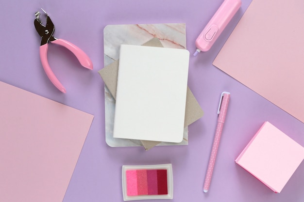 Empty notepad with Stationery set on trendy pastel tones.