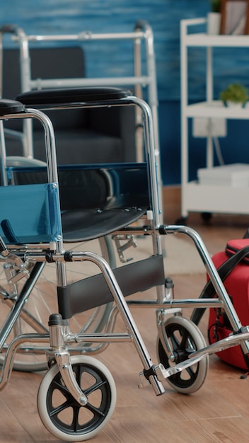 Empty nursing home room with wheelchair and medical equipment