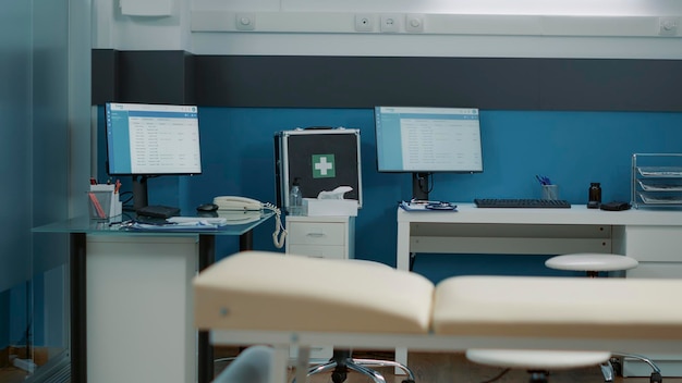 Empty office with medical equipment and instruments used to examine patients and given health care support. Nobody in cabinet where specialist does consultation and appointment.