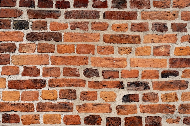 Photo empty old black red brick wall texture background from sweden copy space