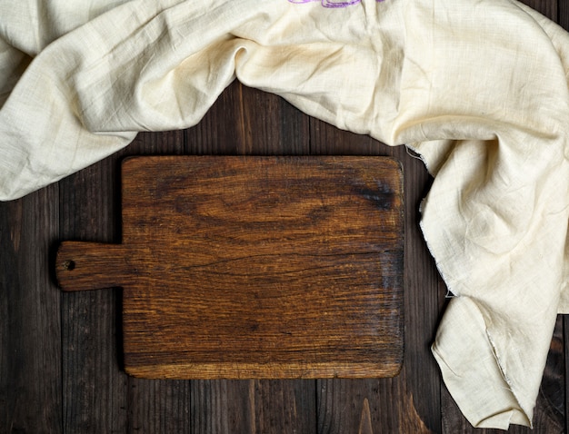 Empty old brown wooden cutting board