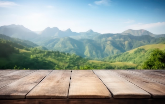 empty old wooden table in front of green mountain and blue sky at summer blurred background