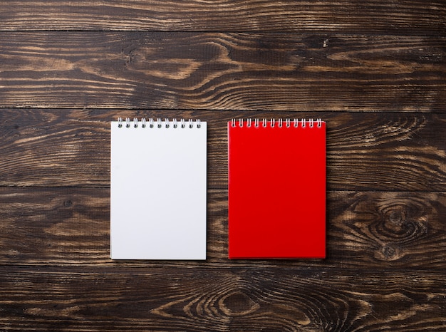 Empty open notebook on wooden surface