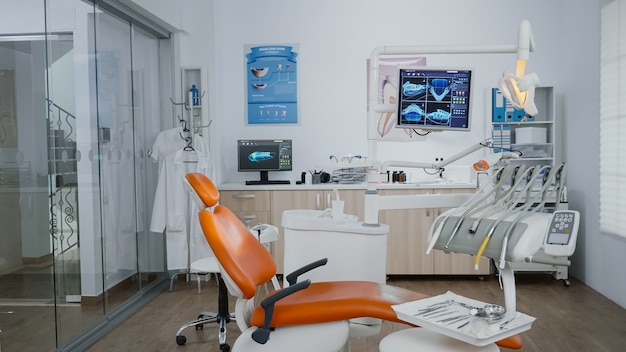 Empty orthodontic stomatology office prepared for teeth treatment after medical dental diagnosis doc...