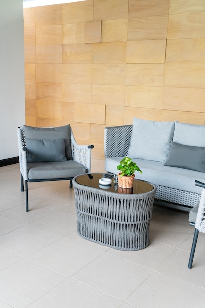 empty outdoor patio chair and table with pillow