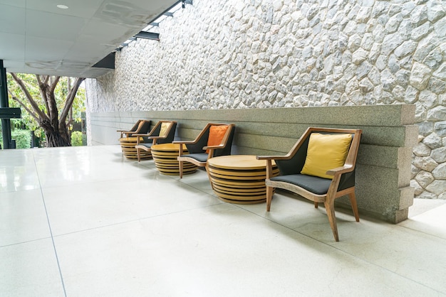 empty outdoor patio chair with pillow on balcony