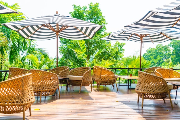 empty outdoor patio table and chair with cushions