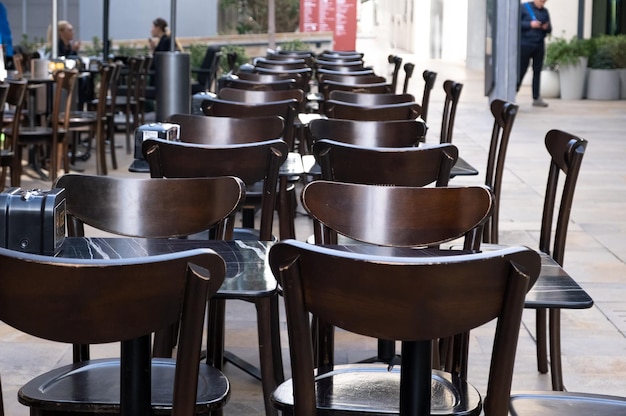 Empty outdoor tables of a cafe.