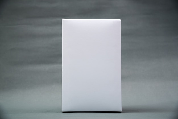 Empty Package white cardboard box or tray for product on grey background.