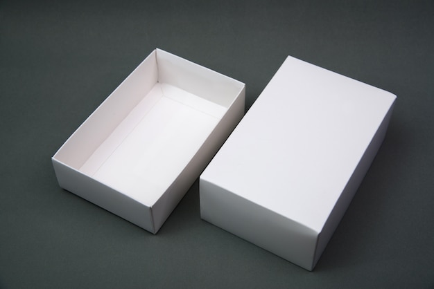 Empty Package white cardboard box or tray  for product on grey background.