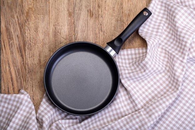 Empty pan on a wooden table