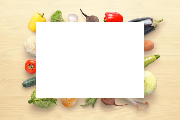 Empty paper on fresh vegetables on kitchen table Vegetables concept Free space for text