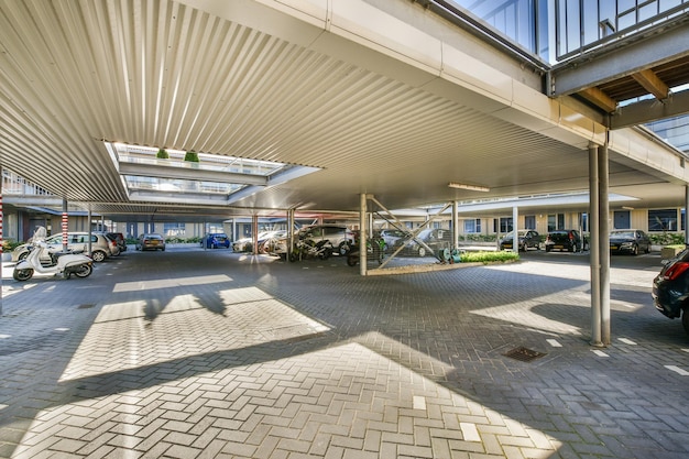 An empty parking lot with cars parked in it