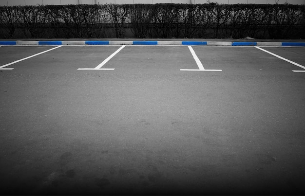 Photo empty parking with blue limiters transportation background