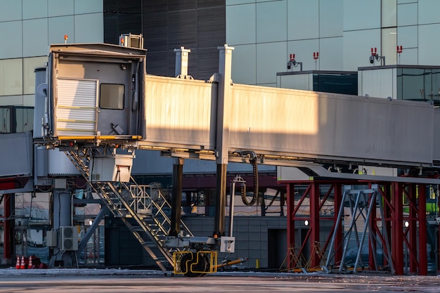 Empty passenger boarding bridge at airport apron