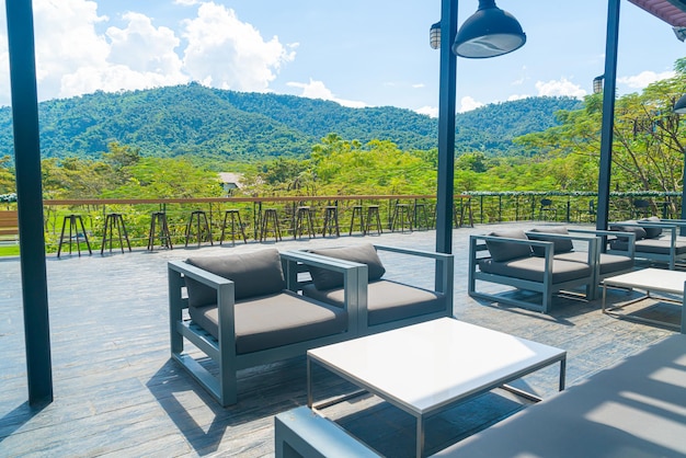 empty patio outdoor chair on balcony with mountain hill backgrpund