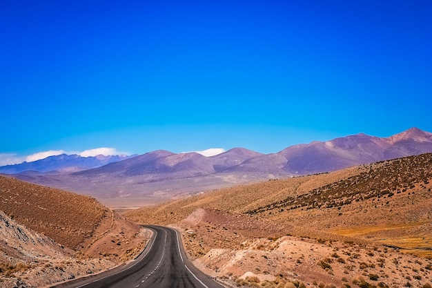 Empty paved road through nevado sajama national park