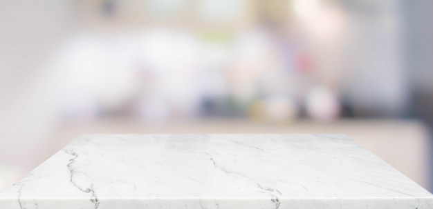 Empty perspective marble table top with blurred home kitchen background