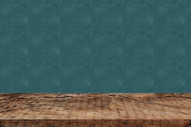 Empty perspective wood plank table top with green background for montage of your product