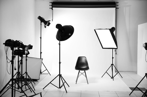 Empty photo studio with lighting equipment