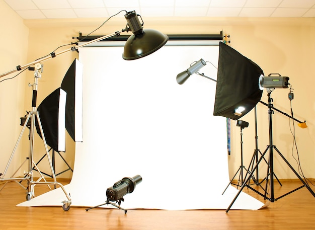 Empty photo studio with lighting equipment