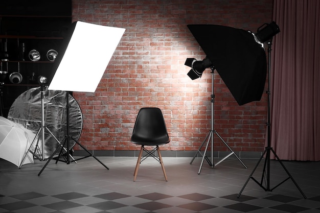 Empty photo studio with lighting equipment