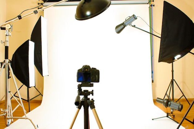 Empty photo studio with lighting equipment