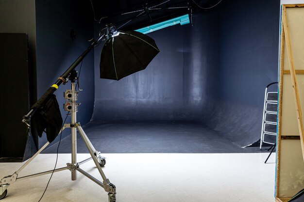 Empty photo studio with lighting equipment