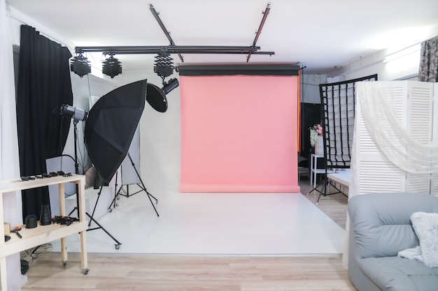 Empty photo studio with professional lighting equipment