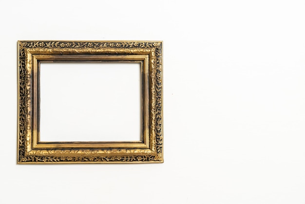 Empty picture frame on white wall background with copy\
space