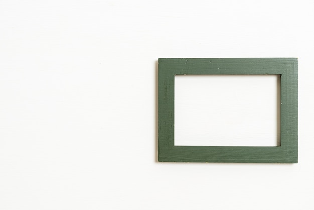 empty picture frame on white wall