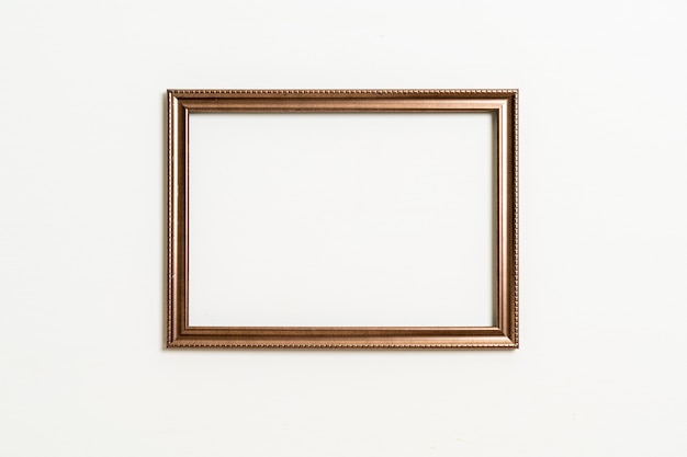 empty picture frame on white wall