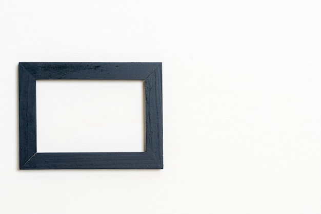 empty picture frame on white wall