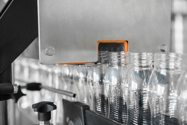 Empty plastic bottles on conveyor belt. equipment at the dairy plant