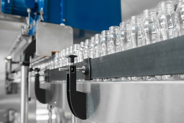 Empty plastic bottles on conveyor belt. equipment at the dairy plant