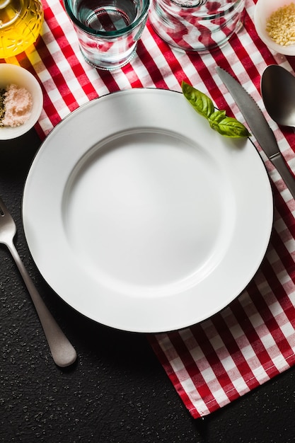 Empty plate on a checkered napkin