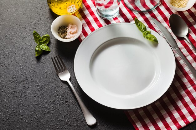 Empty plate on a checkered napkin