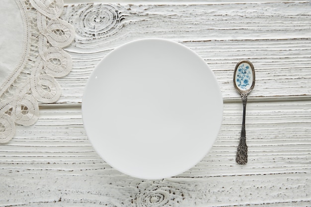 Empty plate dish with spoon food hungry concept