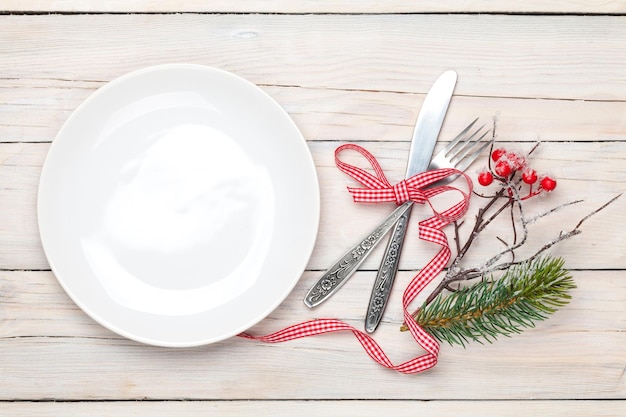 Empty plate silverware and christmas decor